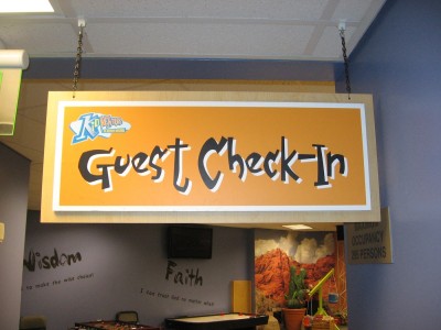 Kid-Ventures-Check-In-hanging-sign
